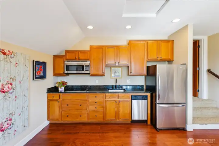 Spacious bonus room with a small and fully equipped kitchen — perfect for guests or entertaining