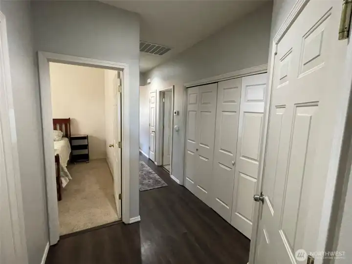 2nd bedroom with hallway laundry room to the right.