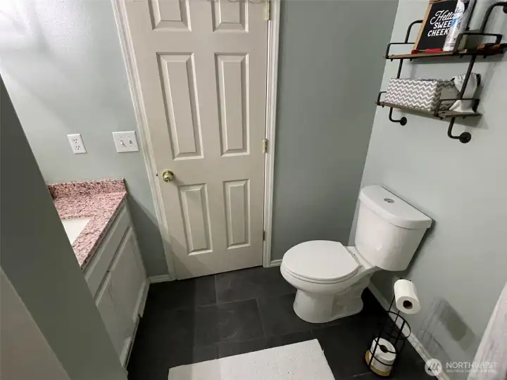 Full bathroom in hallway by 2nd bedroom.