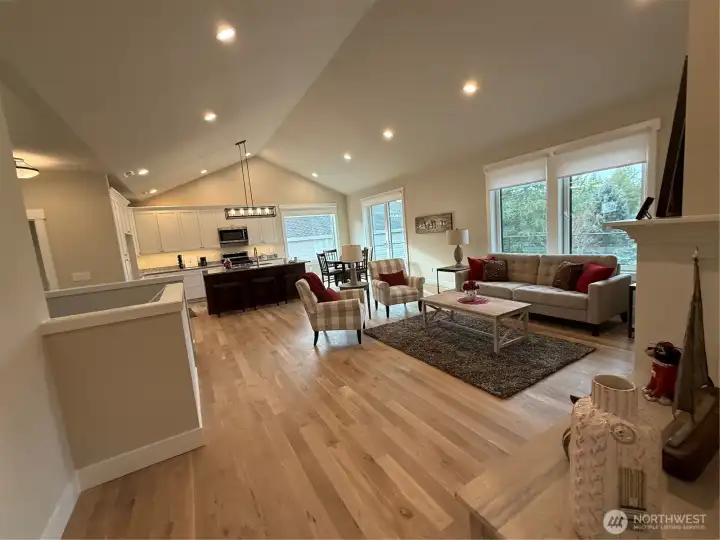 Beautiful triple pane french doors leading to large deck. Don't miss the swing open & Tile open triple pane windows throughout