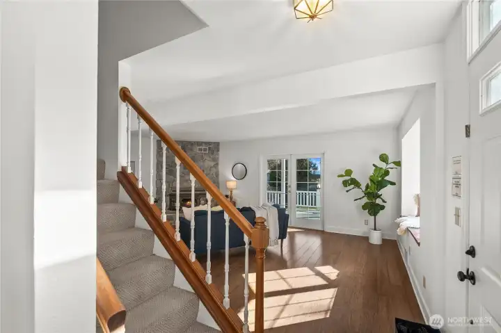 The perfect first impression - a sun-drenched foyer and beautiful, warm hardwood floors.