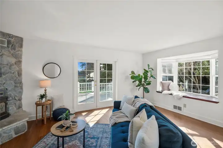 For seamless transitions, retreat outside through these beautiful French doors onto your own covered deck.