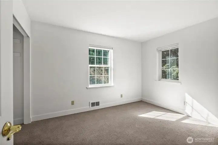 Beyond the main living areas lies a bright, airy secondary bedroom waiting for your personal touch.