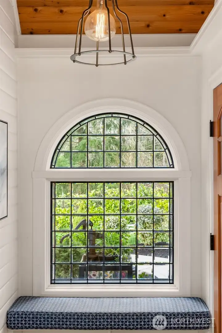 The welcoming entry features a radiant heated floor and entry bench with upholstered seat.