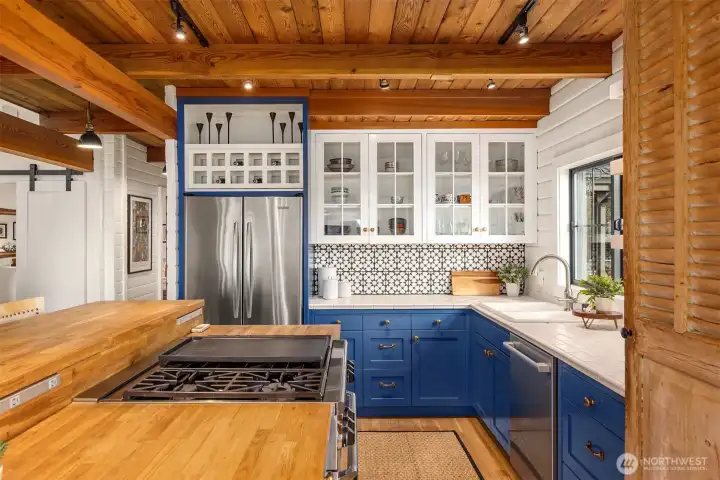 Tongue and groove cedar ceilings, complement the painted cabinetry.