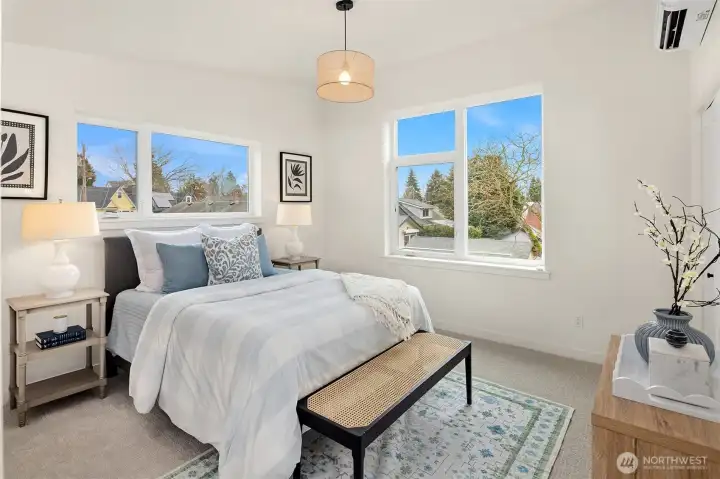 Here we are in the primary suite.  Although it shares the upstaris bathroom with the other bedroom, there is a huge walk in closet and a second closet in this large room with soaring ceilings and great southern light