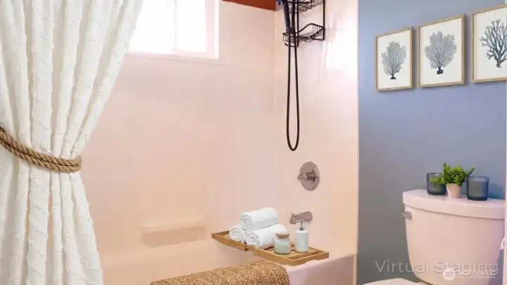 Tub-shower combination with a window for natural light and crisp finishes, offering a fresh, practical space for everyday use.