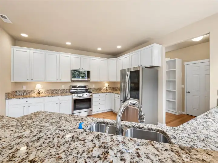 Kitchen view leading to mudroom and garage