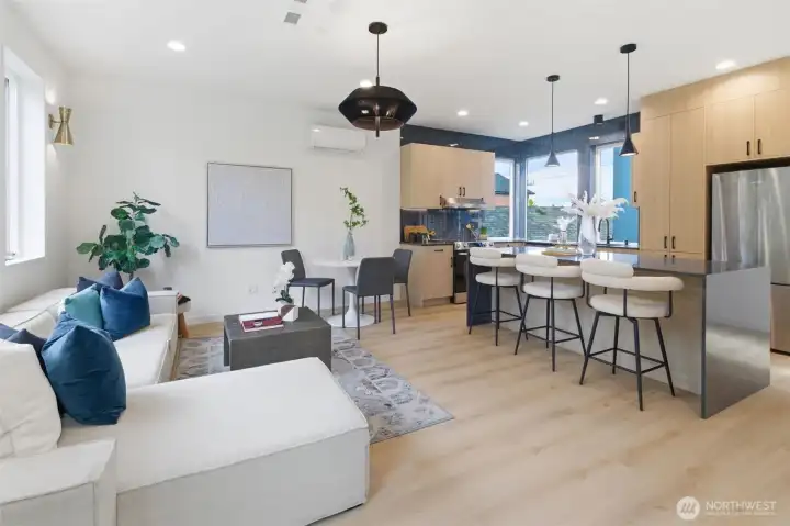 Open-concept main living level with air conditioning, custom lighting, and tons of natural light.