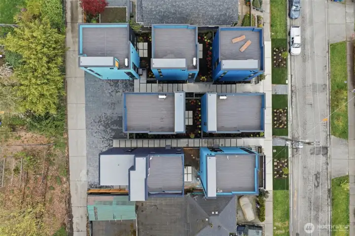 Home C is located in the upper left-hand corner and has an adjacent deeded parking space. There is alley access, and the Magnificent 7 homes are EV charging ready.