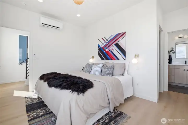 Bright open space, with oversized windows, mini-split heating and cooling, natural light, and seamless modern design.