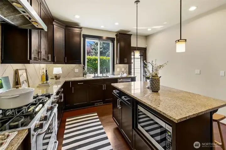 Great eat-in kitchen with breakfast bar and access to the south patio.