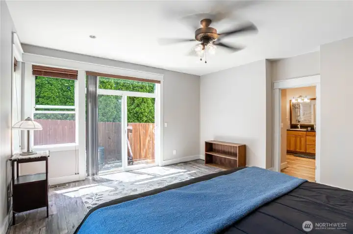 Primary bedroom with slider to back patio