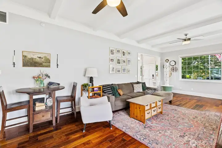 Large living room with beams, high ceilings & natural light!