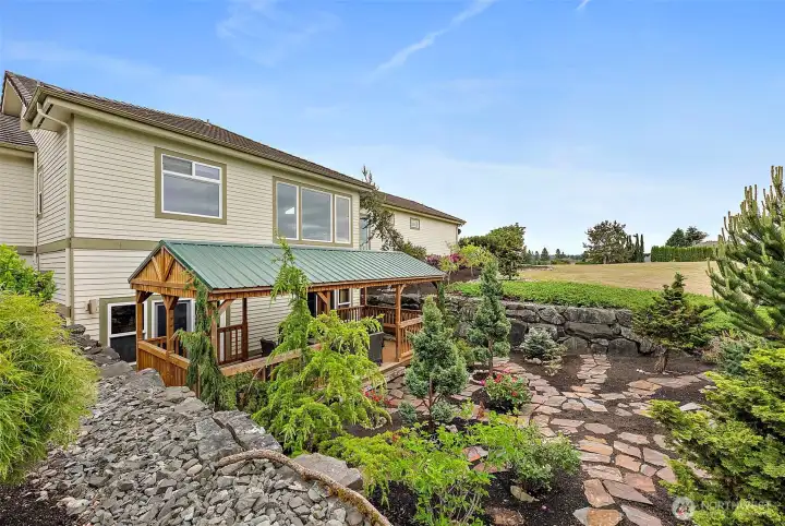 Peaceful Courtyard with Covered Deck. Two Daylight Basement Bedrooms, Each with Sliding Doors, Lead Out To!