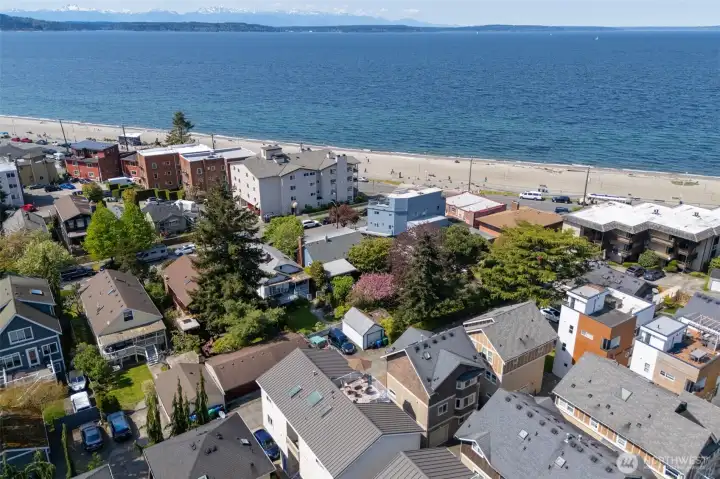 Elevated drone shot of rooftop deck with Puget Sound views and proximity to Alki Beach Elevated drone shot of rooftop deck with Puget Sound views and proximity to Alki Beach