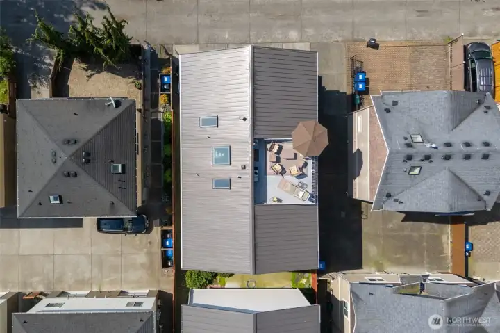 Direct overhead drone shot of rooftop deck and unit Direct overhead drone shot of rooftop deck and unit