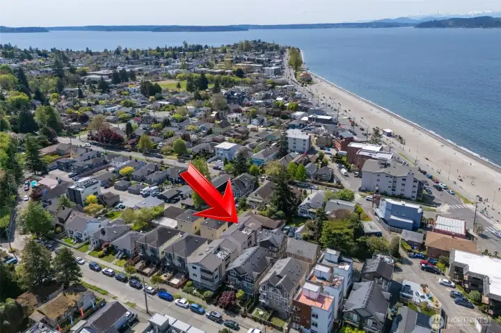 Elevated drone shot with red arrow identifying the building Elevated drone shot with red arrow identifying the building