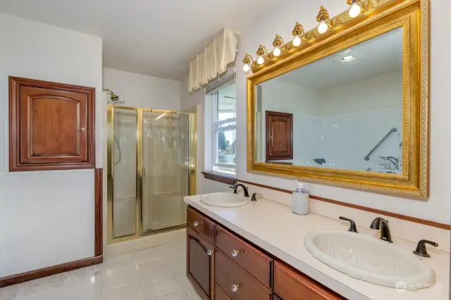 The primary bath has a walk in tub and oversized shower.