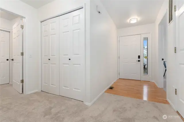 Front entry with hardwood flooring. There is also extra closet space and ample storage throughout.