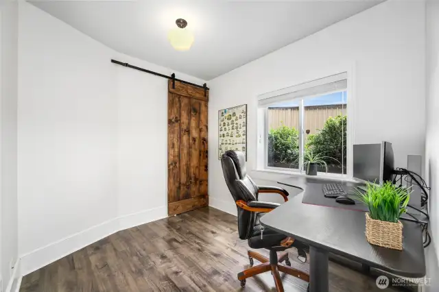 2nd bedroom has a towering wood sliding closet door which hides  organization shelves that say for new owners.
