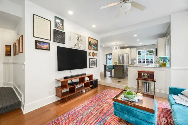 The open lay out makes for an inviting atmosphere in the living room. There is a gas fireplace flanked by tall and deep storage cabinets for media and entertainment storage.There an abundance of windows and natrual light.