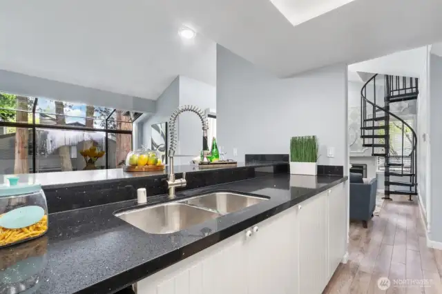 Kitchen is connected to living room and dining room.