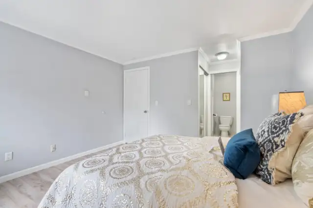 Primary bedroom with private access to the bathroom and two closets.
