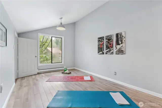 Bedroom on upper level-staged as yoga room.  Can be an office or play room.