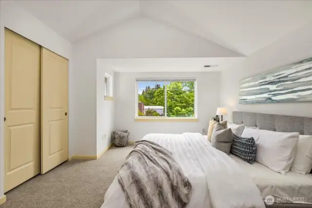 Primary suite with vaulted ceilings