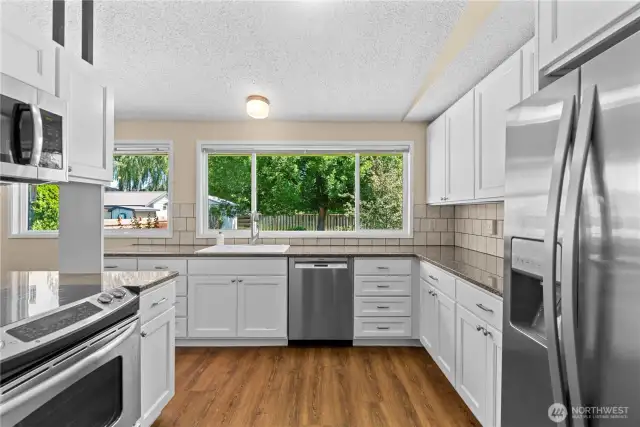 Beautifully updated kitchen with waterproof laminate flooring