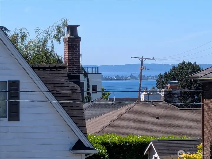 Kitchen veranda has a view of Alki and the ships beyond