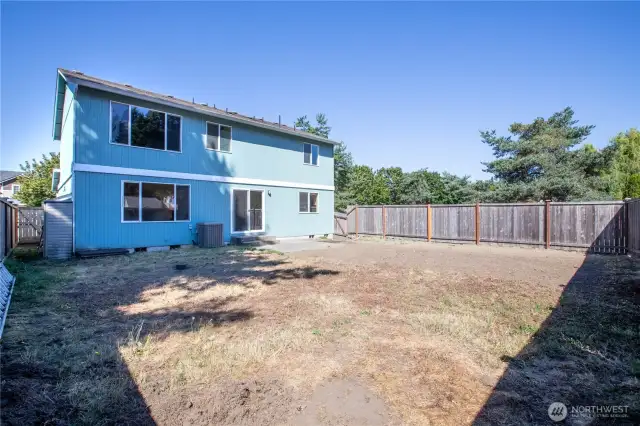 Fully fenced, and also has an out building.