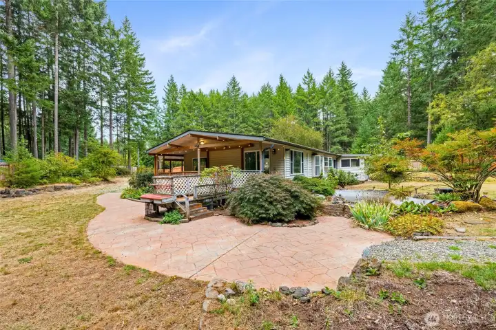 Side of home featuring wrap around deck and