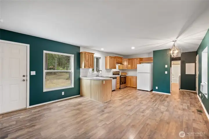 Entrance into open concept Kitchen, dining, living room