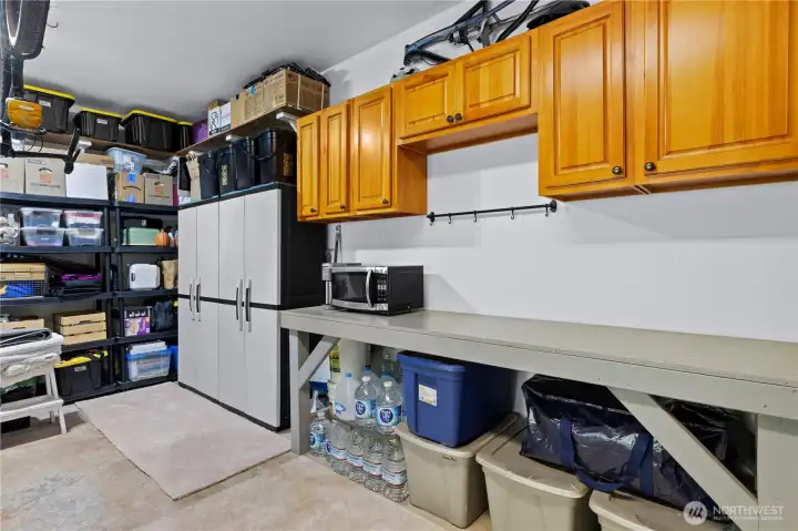 The garage has lots of storage and workshop space.