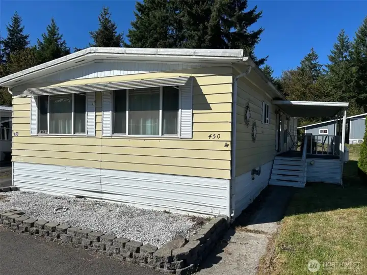 Back side of home with covered patio