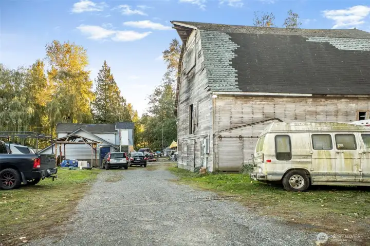 side view of the barn and three additional dwellings.
