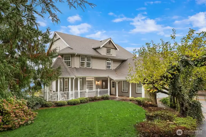 Front view of home, wonderful wrap around porch and covered walk way.