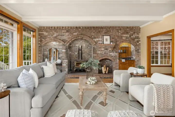 Great family rm with hardwood floors, full wall of brick with wood stove and wet bar.