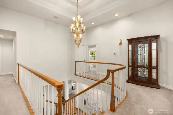 Upper stairway landing with amazing ceiling detail.