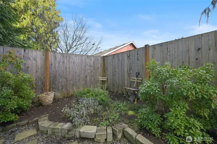 Raised corner bed for herbs or flowers
