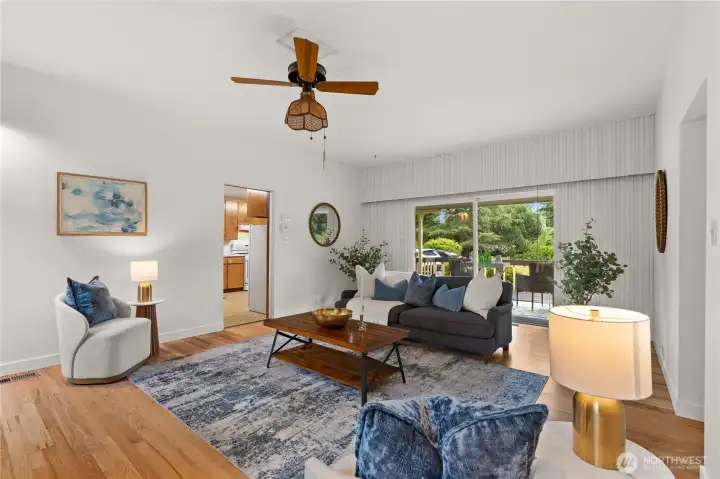 Opposite the fireplace in the main living room, you will find sliding glass doors that offer access to the covered porch Opposite the fireplace in the main living room, you will find sliding glass doors that offer access to the covered porch