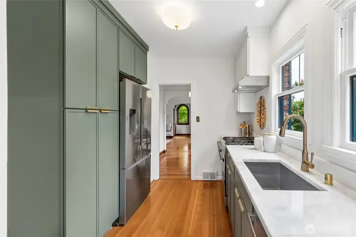 Ample storage with outlet inside pantry for additional appliances.