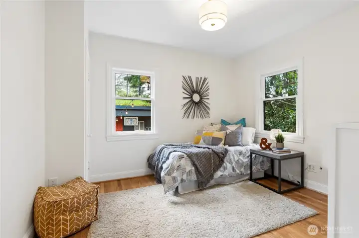Second bedroom on main overlooks lush back yard.