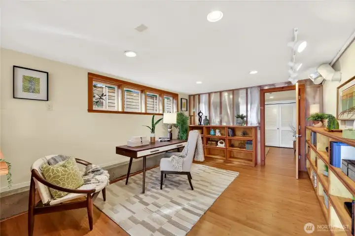 Office/flex space with built in bookshelves and lots of windows. Lots of possibility for multigenerational living or a home business.