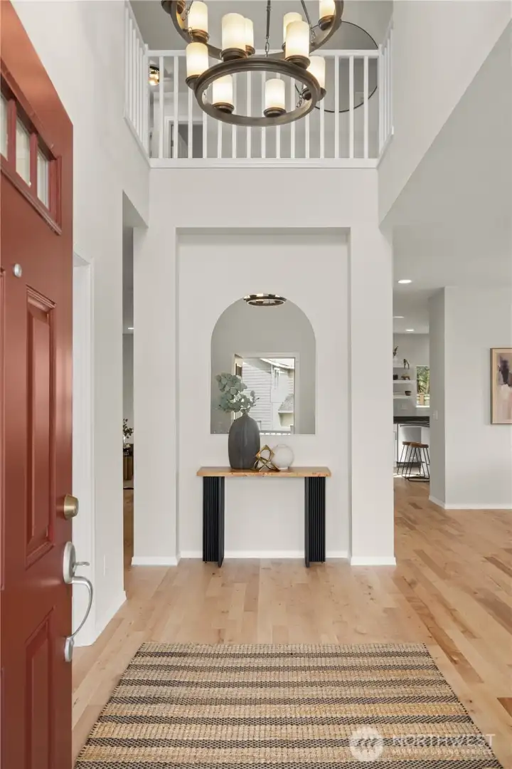 Grand 2-story foyer with open spindle handrail makes for a great first impression. The entryway is adjoined by glass french doors into a lovely den/study.