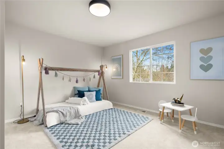 Upper level bedroom. This is one of four bedrooms upstairs in the home.
