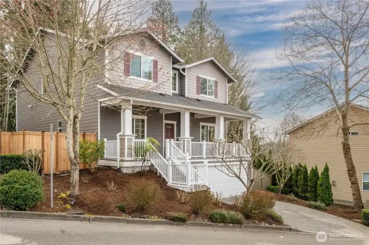 Charming curb appeal is enhanced by a unique lot position that maximizes both privacy and additional usable yard space. Seasonal hydrangeas bring vibrant color and visual interest throughout the spring and summer months, while mature trees create a natural sense of tranquility. This thoughtfully situated homesite offers a rare blend of beauty, privacy, and outdoor enjoyment.