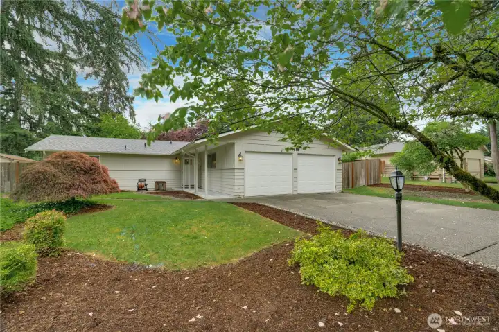 Welcome to this beautifully maintained Rambler with a new roof!